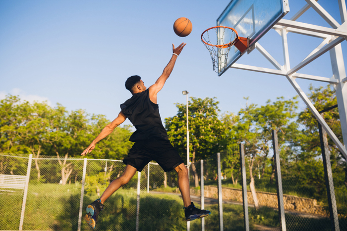 Basketball Selection Guide-cool-black-man-doing-sports-playing-basketball-sunrise-jumping