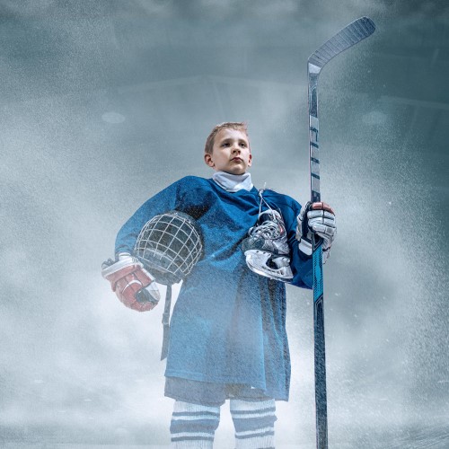 leader-little-hockey-player-with-stick-ice-court-smoke-background-sportsboy-wearing-equipment-helmet-training-action-concept-sport-childhood-motion-movement-action