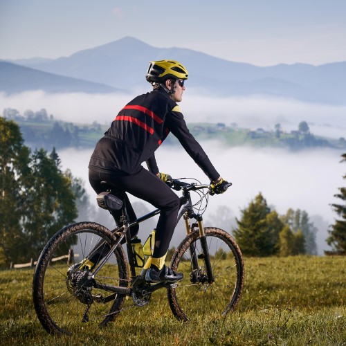 male-cyclist-riding-bicycle-mountains