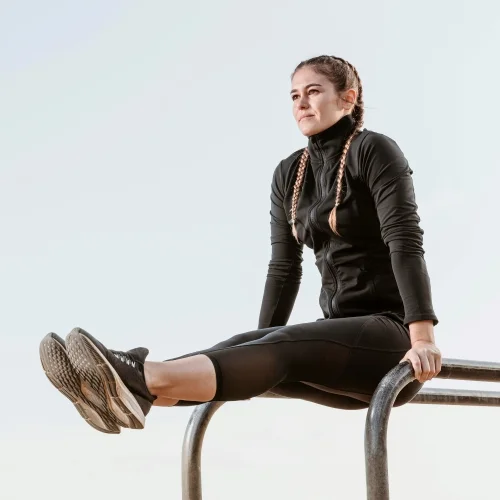 side-view-athletic-woman-exercising-outdoors-use-training wear