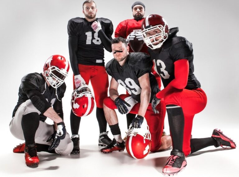 Latvia football players posing full-length with a ball